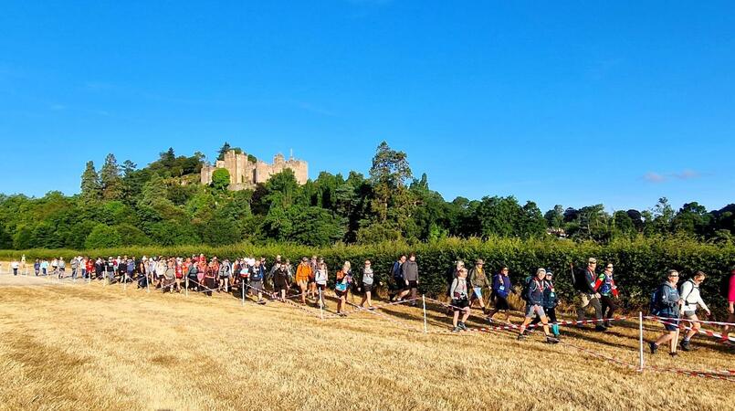Trekkers walking near castle on South West 50
