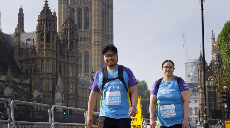 2 people walking through London