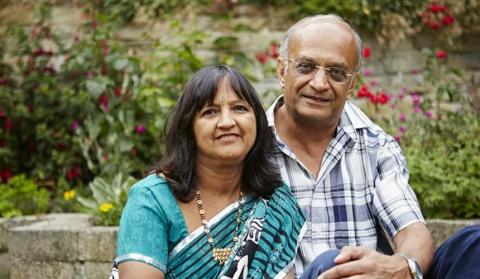 A couple sitting together outside