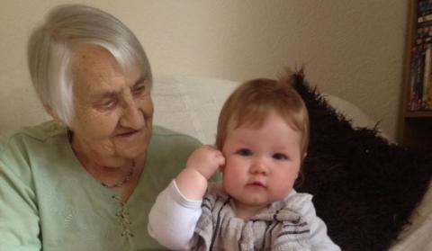 Dorothy with her great-grandchild on her lap, before coronavirus