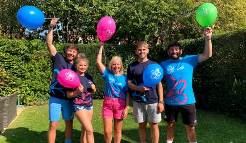 Marie's family wearing Memory Walk t-shirts and holding balloons