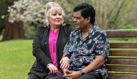 France sitting on a bench with his wife, Helen