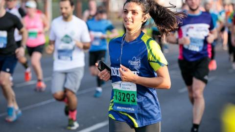 A woman running the Greater Manchester Marathon