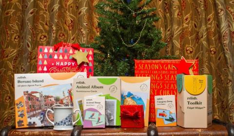 A selection of Christmas gifts in front of a Christmas tree