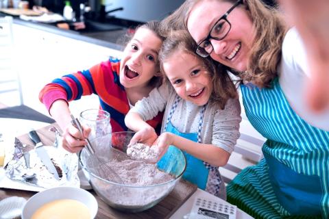 Mother and children baking