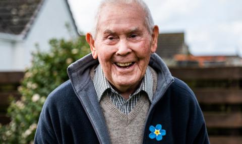Geoff wearing a Forget Me Not Appeal pin badge