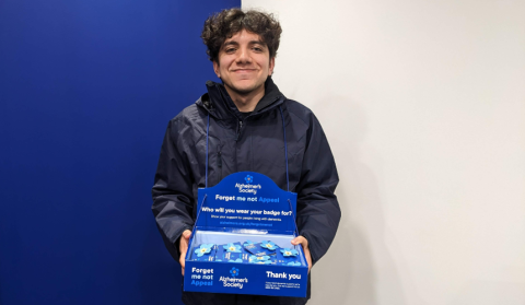 Jack holding a Forget Me Not Appeal collection box
