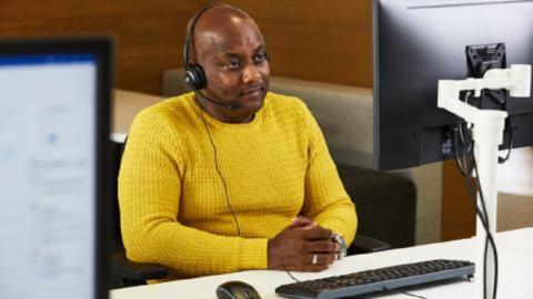 A dementia support line adviser