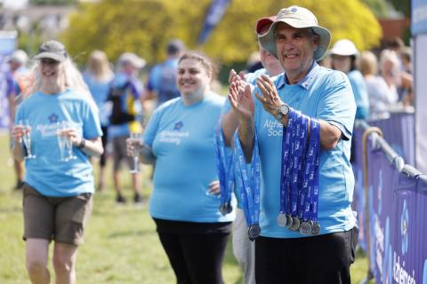 Volunteers greeting walkers at finish line