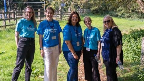 Five British Airways staff on a Memory Walk wearing Memory Walk t-shirts