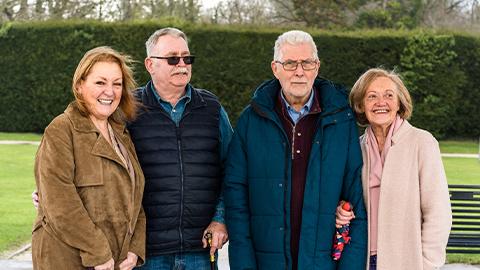 Four campaigners standing outside in a garden.