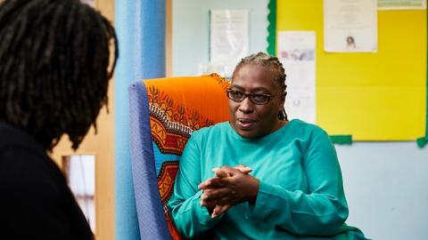 A woman talking to her GP.