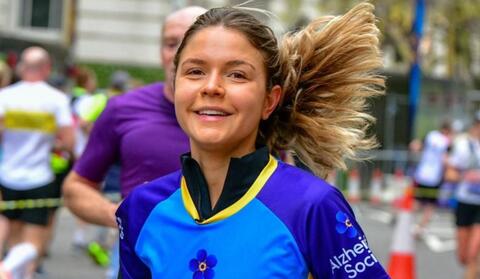 A woman running in an Alzheimer's Society t-shirt