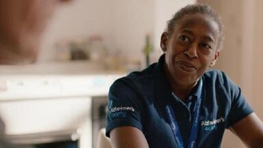 A Dementia Adviser smiling towards the camera