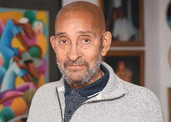 Portrait of Howard Ducille and Alzheimer's Society mascot