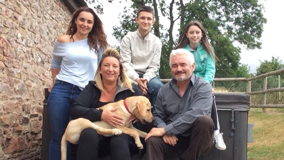 A family photo taken in a garden