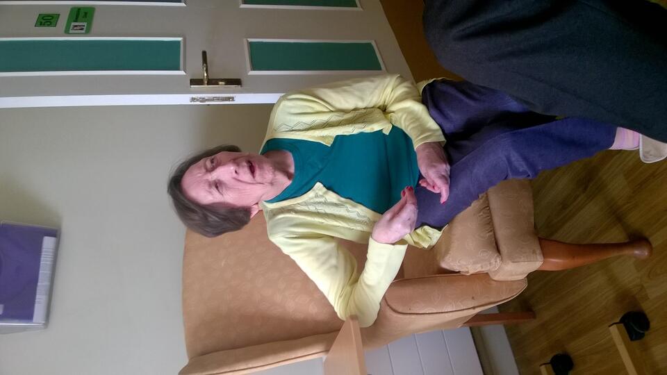 A woman sat in a chair