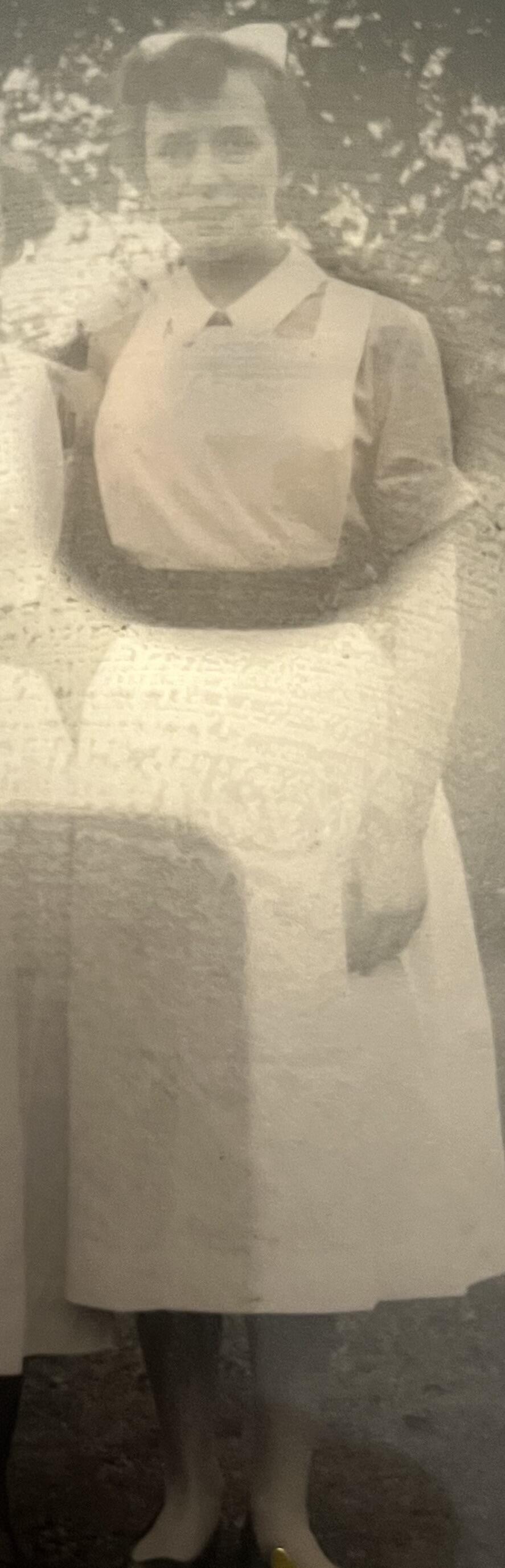 A sepia photo of a female nurse