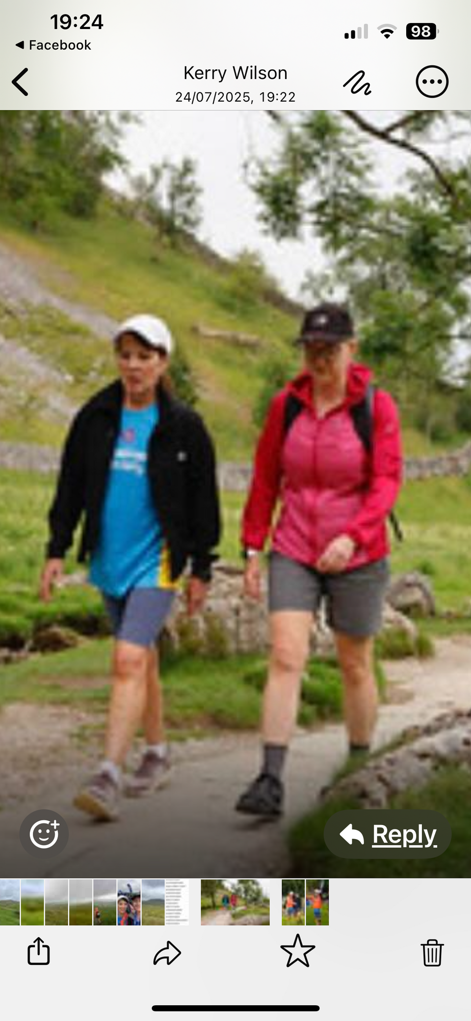 Two people hiking on a path
