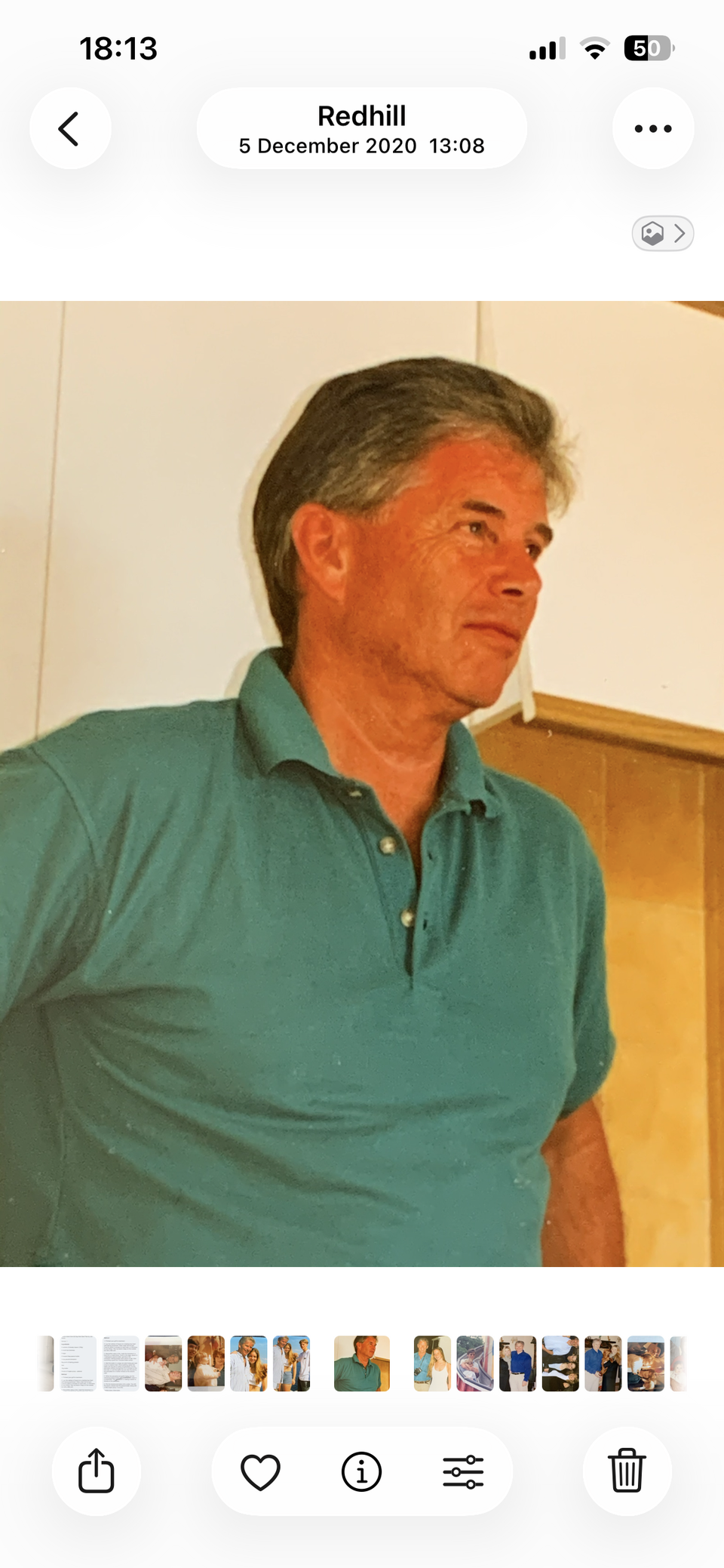 A man wearing a green polo