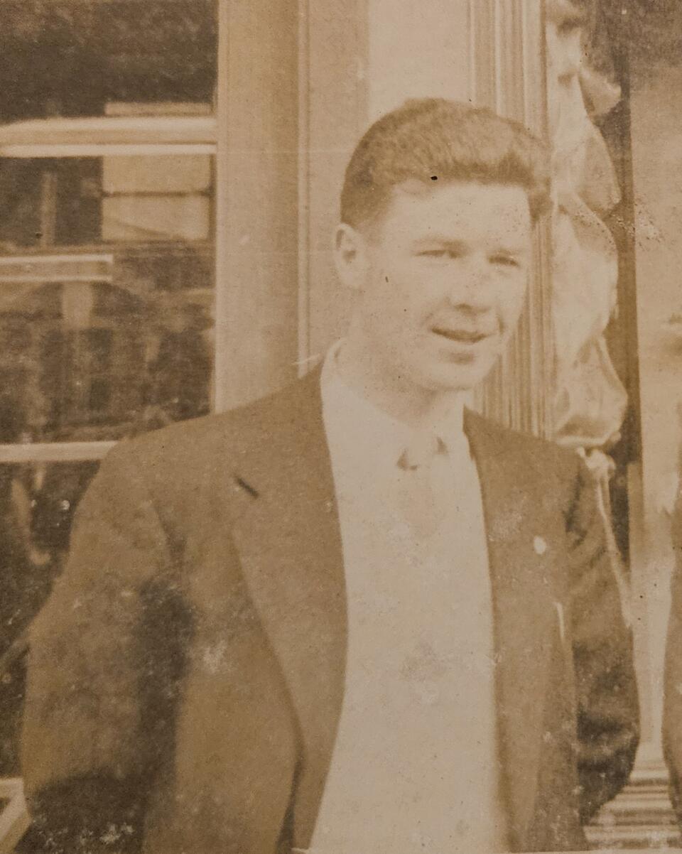 A sepia photo of a man in a suit
