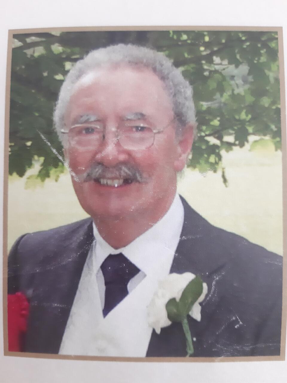 A smiling man in a suit