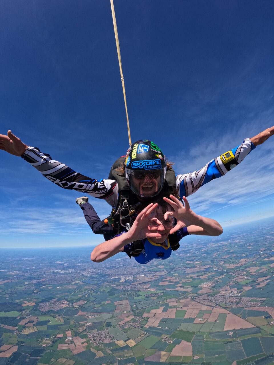 A woman and man skydiving