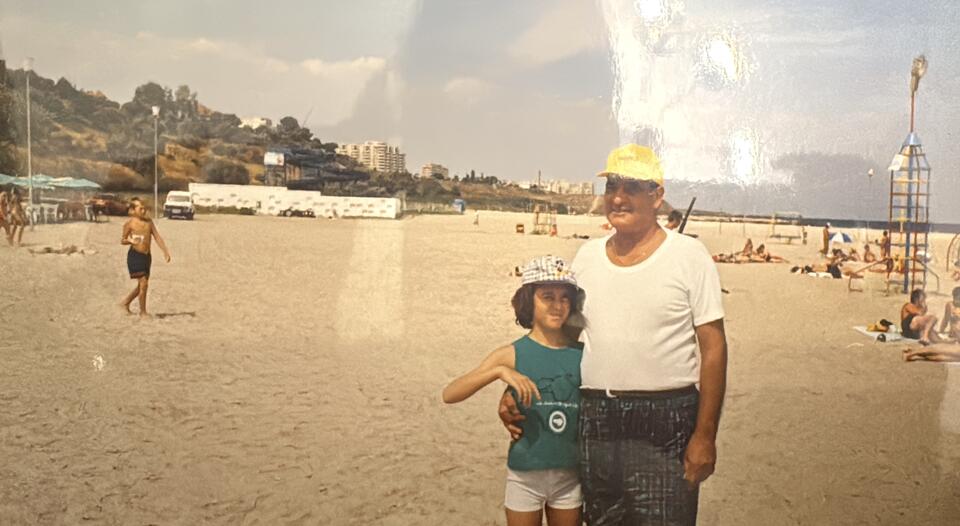 A man and a girl on a beach