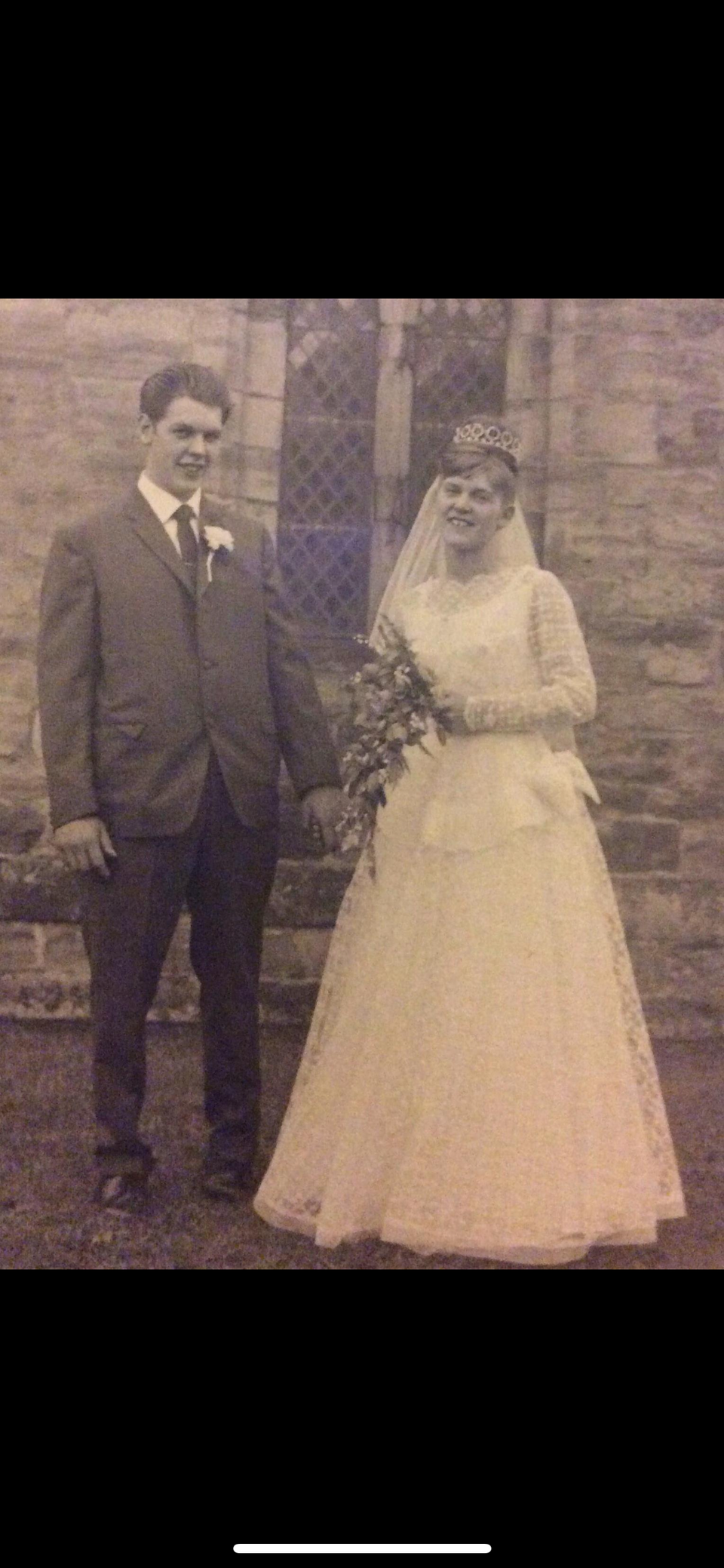 A sepia photo of a bride and groom