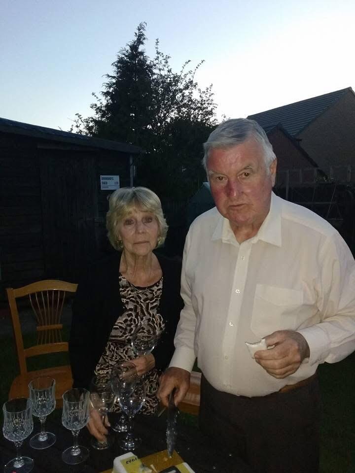 An older couple in a garden