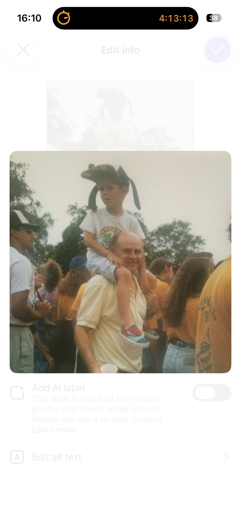 A boy sat on a man's shoulders surrounded by a crows