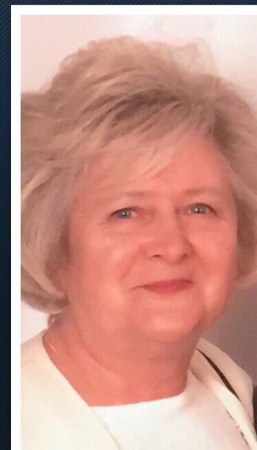 A woman with short blonde hair