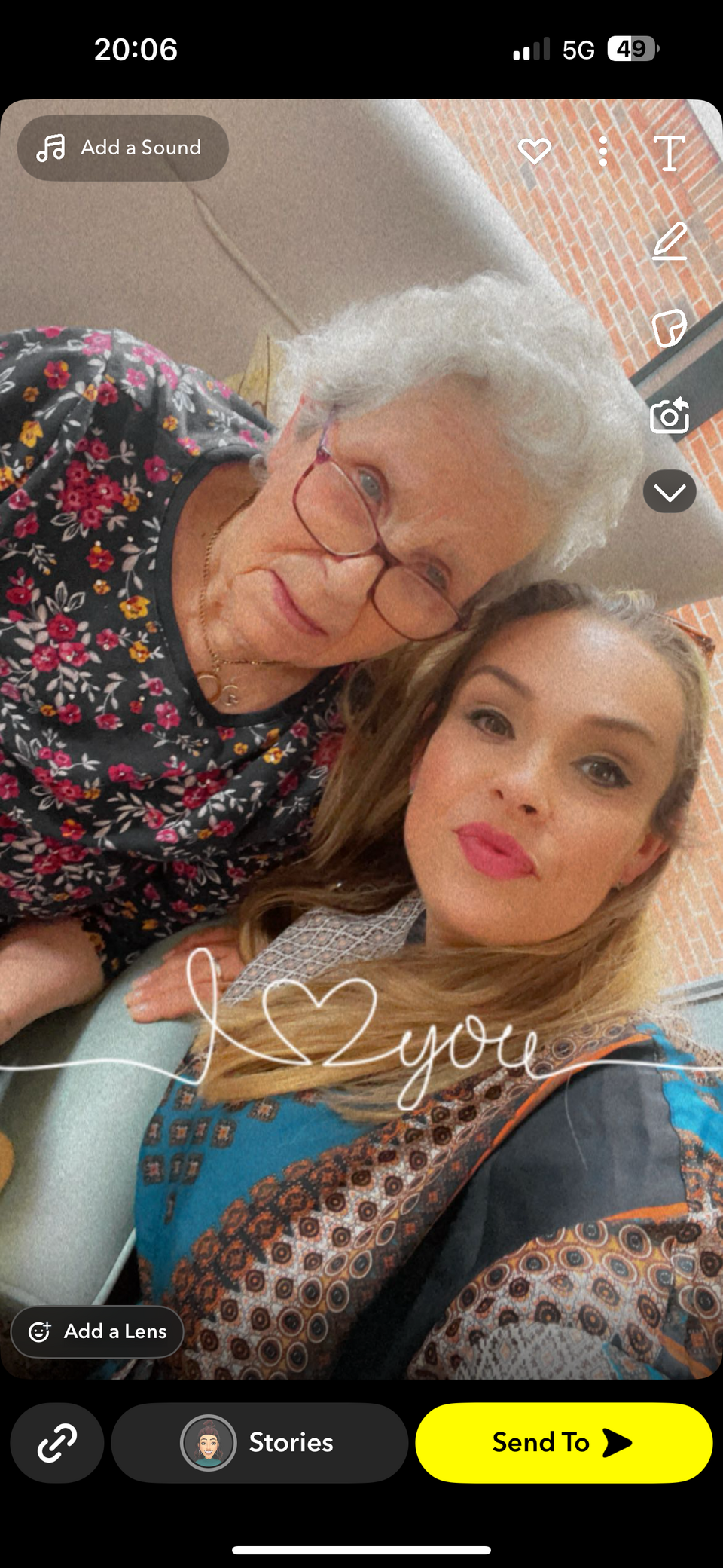 A selfie of an older woman with grey hair and glasses and a younger woman with long blonde hair