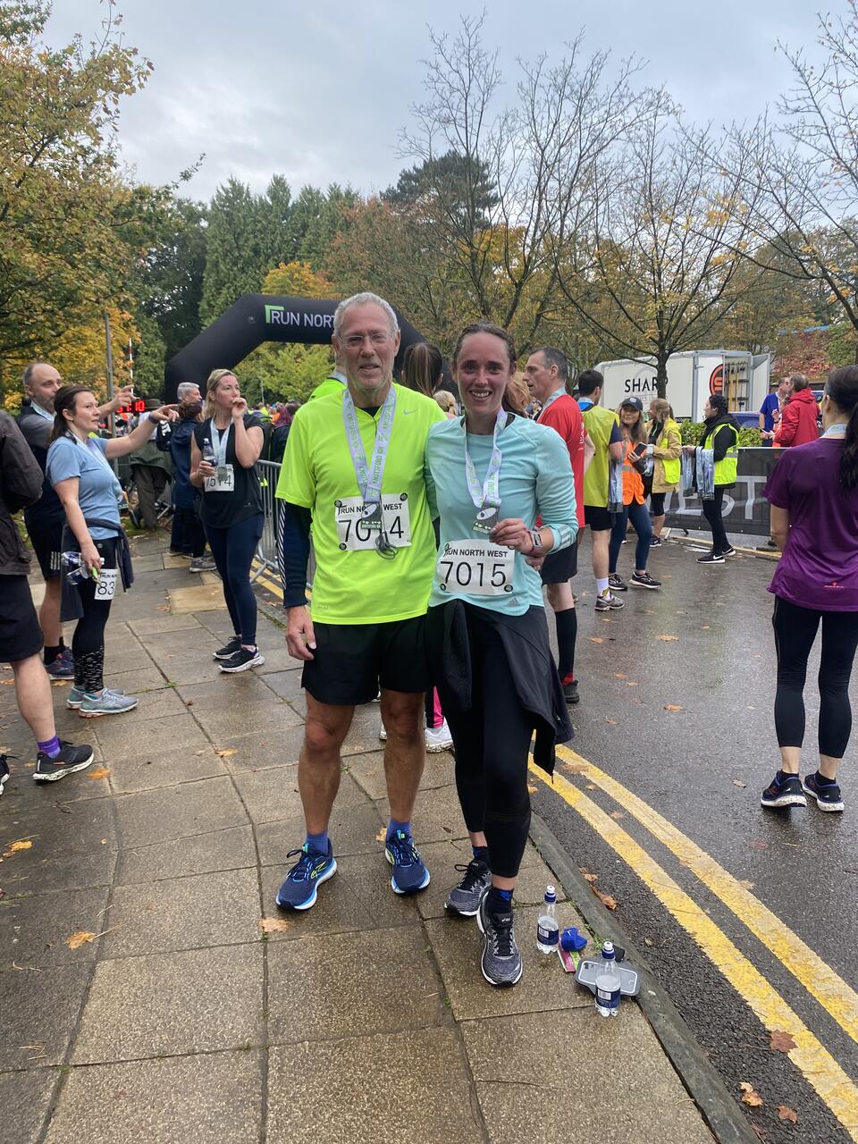 Two people at a stood at a rainy run