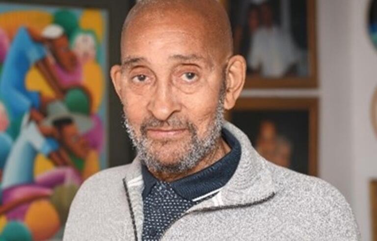 Portrait of Howard Ducille and Alzheimer's Society mascot