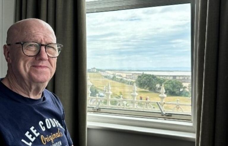 Geraint Roberts in front of a lovely window view