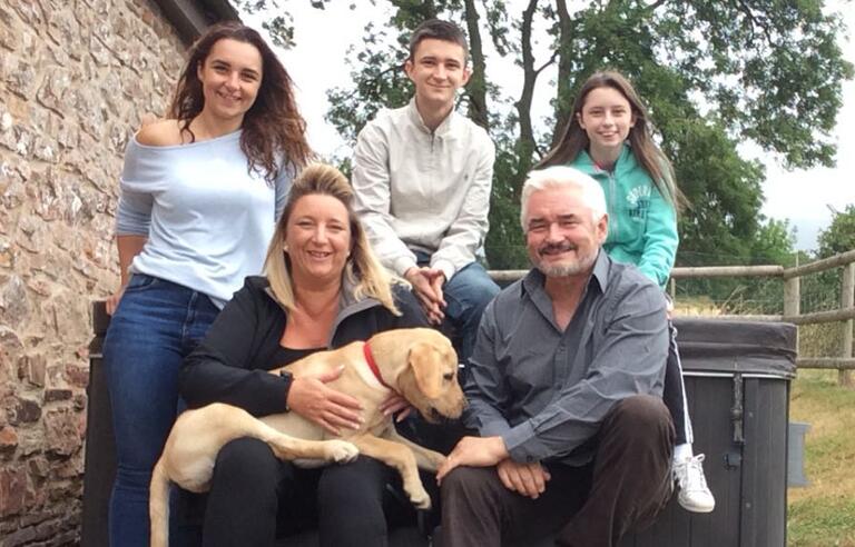 A family photo taken in a garden