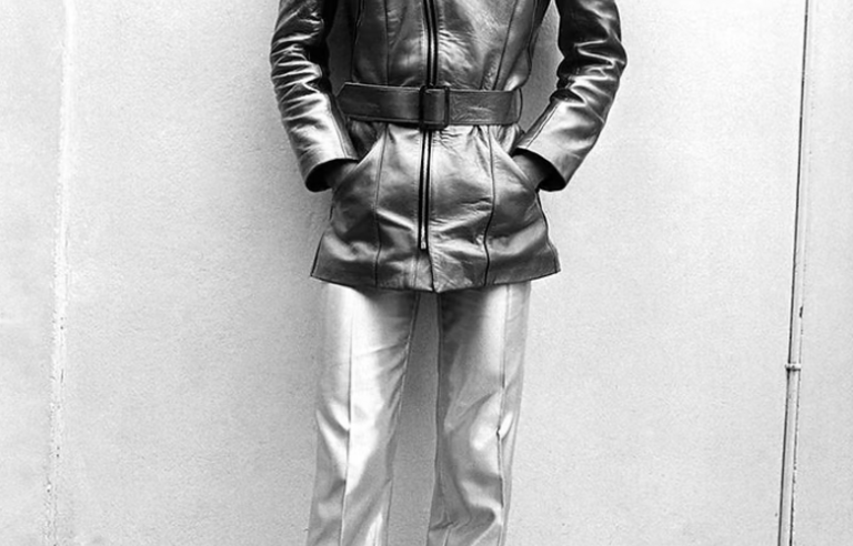 A black and white photo of a man in mid-century clothes