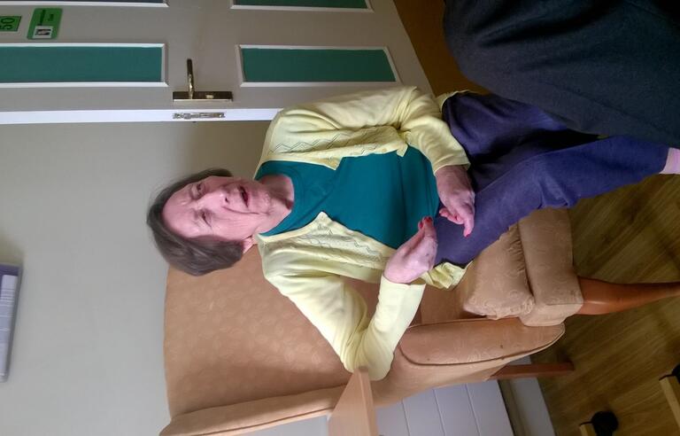 A woman sat in a chair