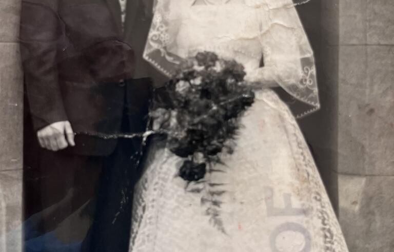 A black and white photo of a groom and bride