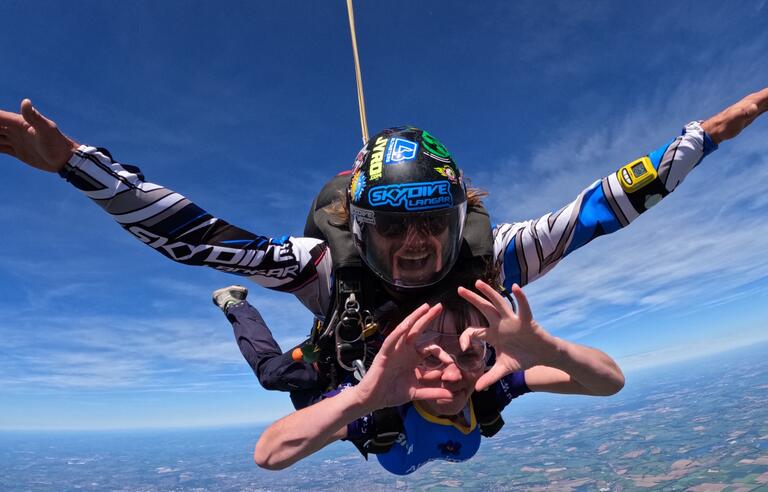 A woman and man skydiving