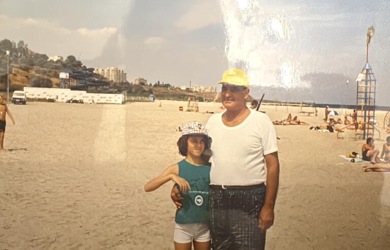 A man and a girl on a beach