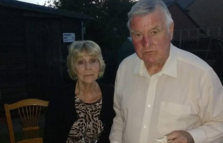 An older couple in a garden