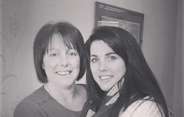 A black and white photo of two woman smiling