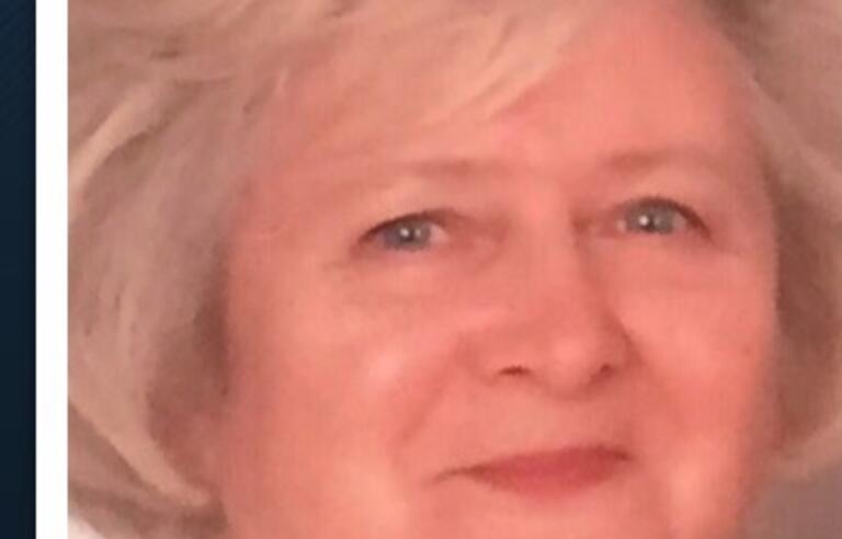 A woman with short blonde hair