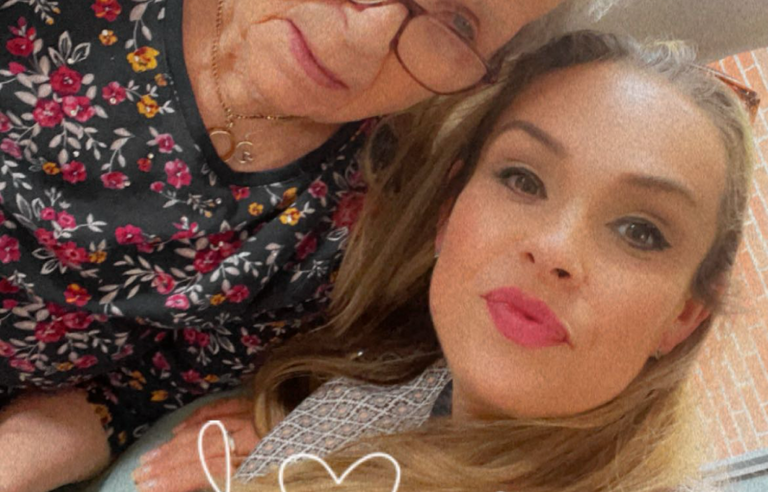 A selfie of an older woman with grey hair and glasses and a younger woman with long blonde hair