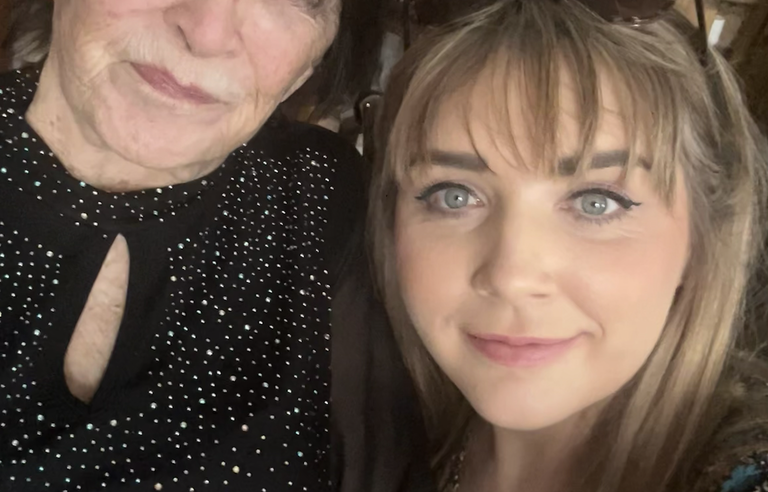 A selfie of a woman with a short brown bob and a younger woman with long blonde hair